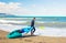 Man carrying kayak at sea beach