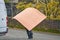 Man Carrying Large Wooden Sheets