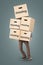 A man is carrying many moving boxes - isolated on a neutral background