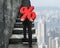 Man carrying percentage sign climbing on old concrete stairs