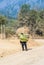 Man carrying pile of banana steam