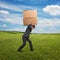 Man carrying two heavy boxes at outdoor