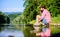 Man catching fish. Man at riverside enjoy peaceful idyllic landscape while fishing. Guy fly fishing. Successful fly