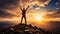 Man celebrating on a mountaintop with arms raised