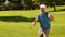 Man celebrating on the putting green of golf course