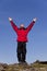 Man Celebrating Success On Top Of A Mountain