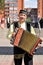Man of Central Asia nationality in a Tatar national costume with an accordion on the street of Visaginas city, Lithuania