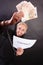 Man with chained hands holding contract and money