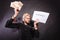 Man with chained hands holding contract and money