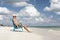 Man in chair on Caribbian beach