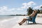 Man in chair on Caribbian beach