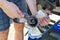 Man changing propeller on outboard motor. Repairing outboard motor for boat, replacing screw.