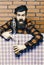 Man in checkered shirt near shaker, brick wall and blue tablecloth background. Barman advice concept. Barman with beard