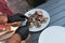 Man checking barbecue chicken with knife. Delicious meat.