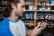 Man checking grocery items in supermarket