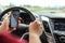 Man checking his text messages while driving. Dangerous texting in car concept