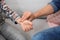 Man checking little boy`s pulse with fingers indoors