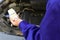 Man checking motor oil level with dipstick, closeup