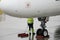 Man checking plane on apron