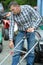 Man checking yard with lawn mower