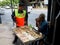 A man checks an amulet in Bangkok