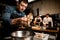 man chef holds oyster mushrooms over bowl on kitchen