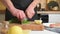 Man chef professionally slices parsley on cutting board. Husband cooking