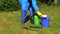 Man with chemistryproof clothing hand pour fertilizer to spray