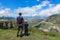 A man with a child on the background of a view of the Matlas plateau. Khunzakhsky district. Dagestan Russia 2021