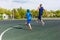 Man and child engaged on the sports ground