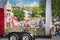 Man and children wave from farm themed parade float