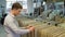 A man chooses ceramic tiles in a hardware store