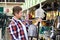 Man chooses shovel in shop to work in garden