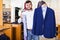 Man choosing casual jacket in fashion store