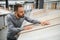 man choosing laminate samples in hardware store