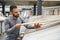 man choosing laminate samples in hardware store