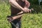 A man chops firewood on a hike