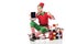 man in christmas elf costume sitting on sleigh and holding tablet with apple home screen isolated