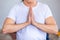 A man clasped his hands in a yoga pose