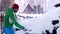 Man cleaning car after snow blizzard