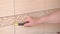 Man cleaning ceramic tiles in the kitchen