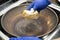 man cleaning a dirty cooking pan at horizontal composition