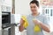 Man Cleaning Domestic Oven In Kitchen