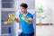 The man cleaning fridge in hygiene concept