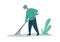 Man cleaning garbage. Male with rake. Activist in uniform working outdoors. Debris removal. Volunteer collecting rubbish