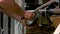 Man cleaning horse foot close up.