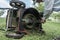 Man cleaning lawn mower blade.