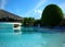 A man cleaning the pool at tropical resort