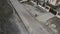 a man cleaning the road with a special device for laying new asphalt. aerial