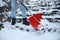 Man cleaning stairs from snow with shovel on winter day, closeup